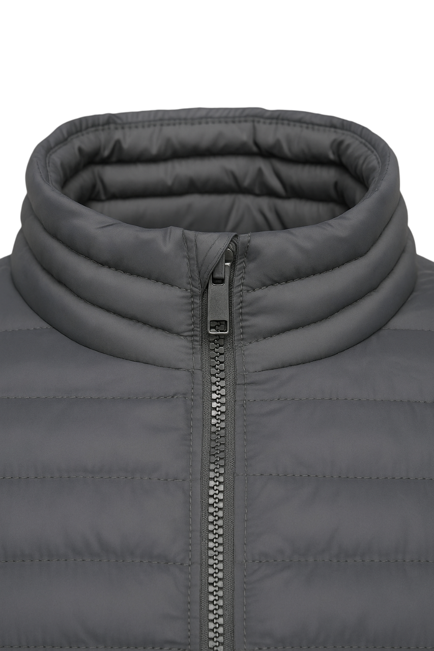 Close-up of a gray puffer jacket with a zipper on a white background