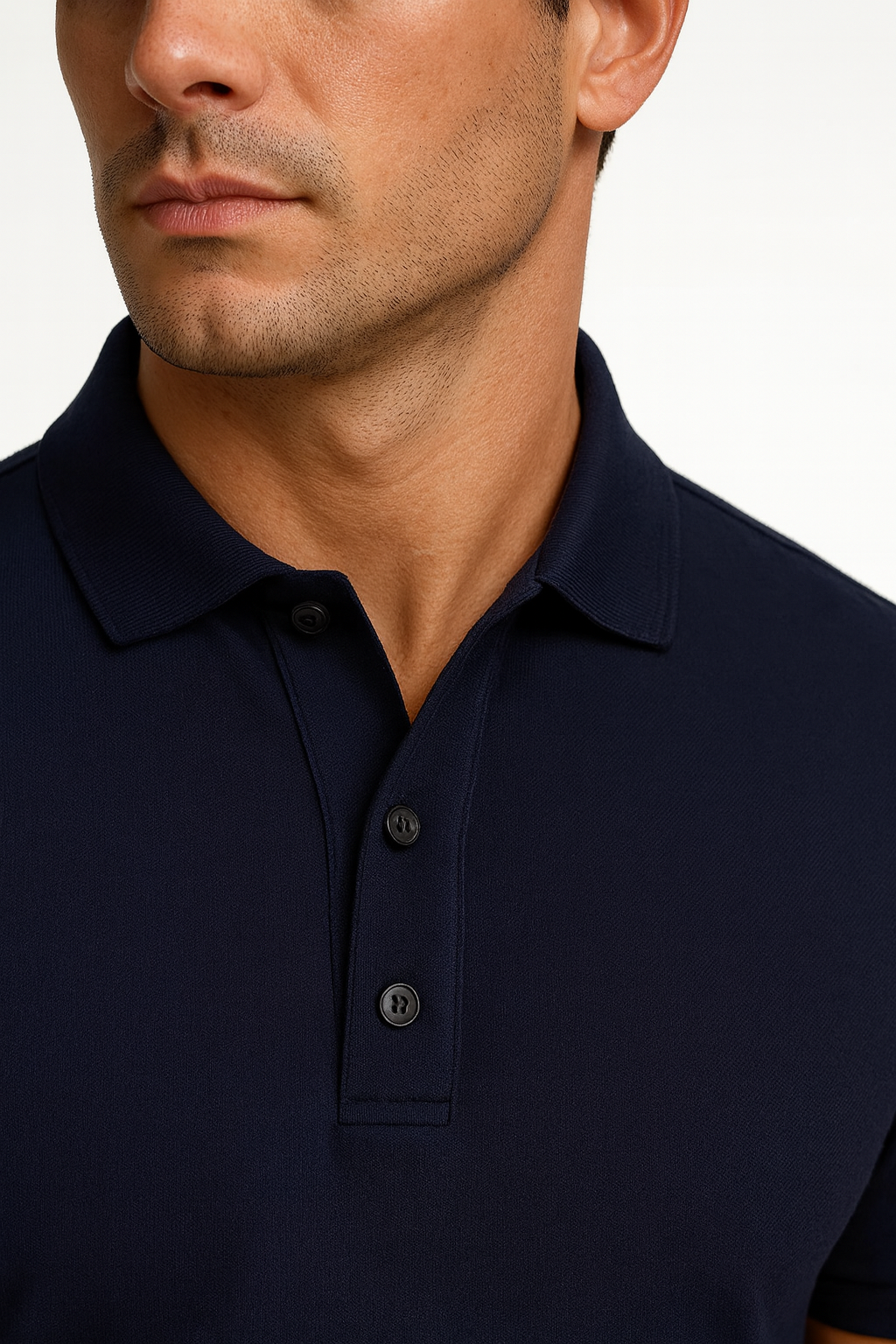 Navy blue polo shirt worn by a person on a white background