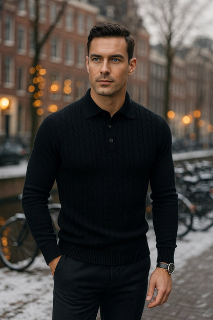 Man wearing a black sweater standing on a street with bicycles and buildings in the background