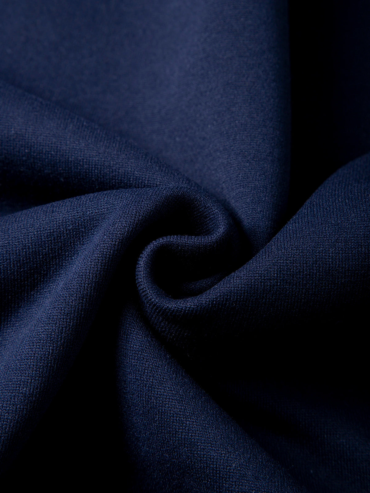 Close-up of dark blue fabric with folds