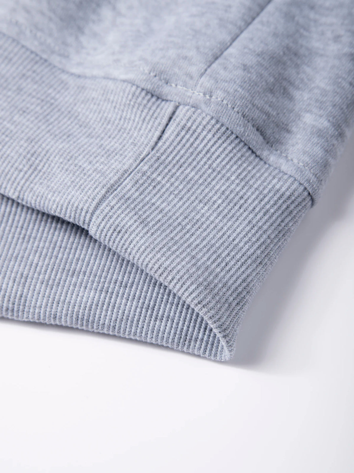 Close-up of a gray sweatshirt on a white background