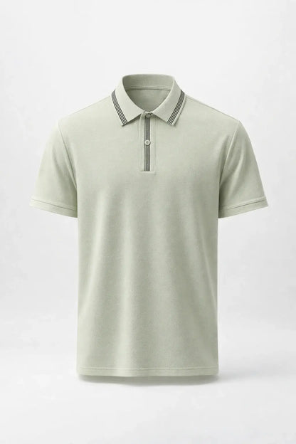 Light green polo shirt with striped collar on a white background